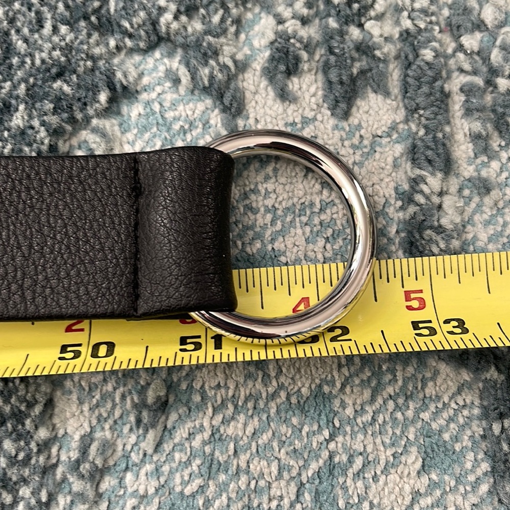 Below the belt black OS 52 1/2” long 1 1/2” wide